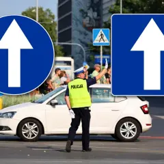 Policjant kieruje ruchem przy znakach "droga jednokierunkowa". Biała strzałka na niebieskim tle informuje o kierunku jazdy.