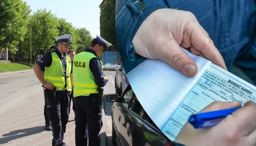 Policjanci wypisują mandat za wykroczenie, być może niebezpieczne wyprzedzanie. Kierowca otrzymał karę finansową.